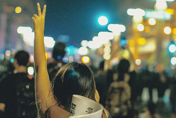 A group of peaceful protesters at night